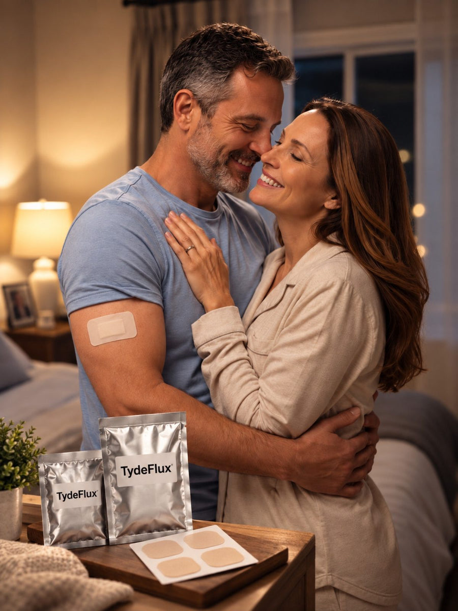 Couple embracing, a TydeFlux patch on his arm and pouches on the table
